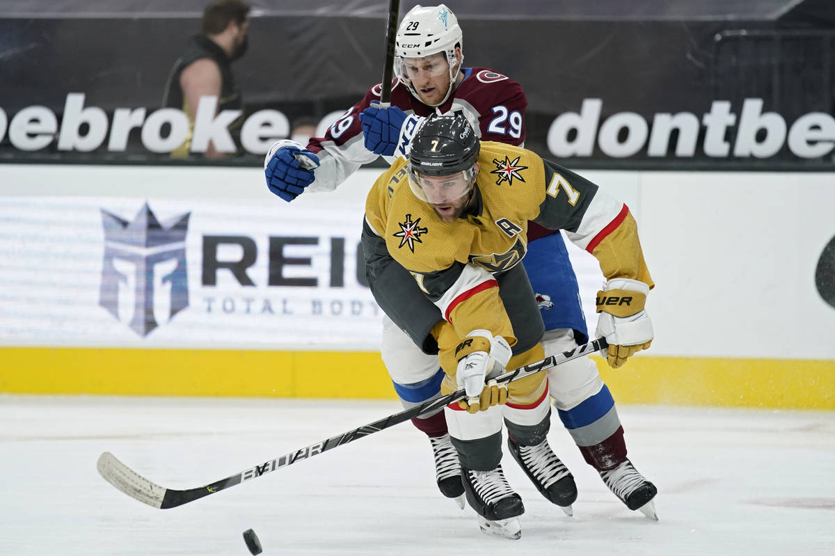 Vegas Golden Knights defenseman Alex Pietrangelo (7) and Colorado Avalanche center Nathan MacKi ...