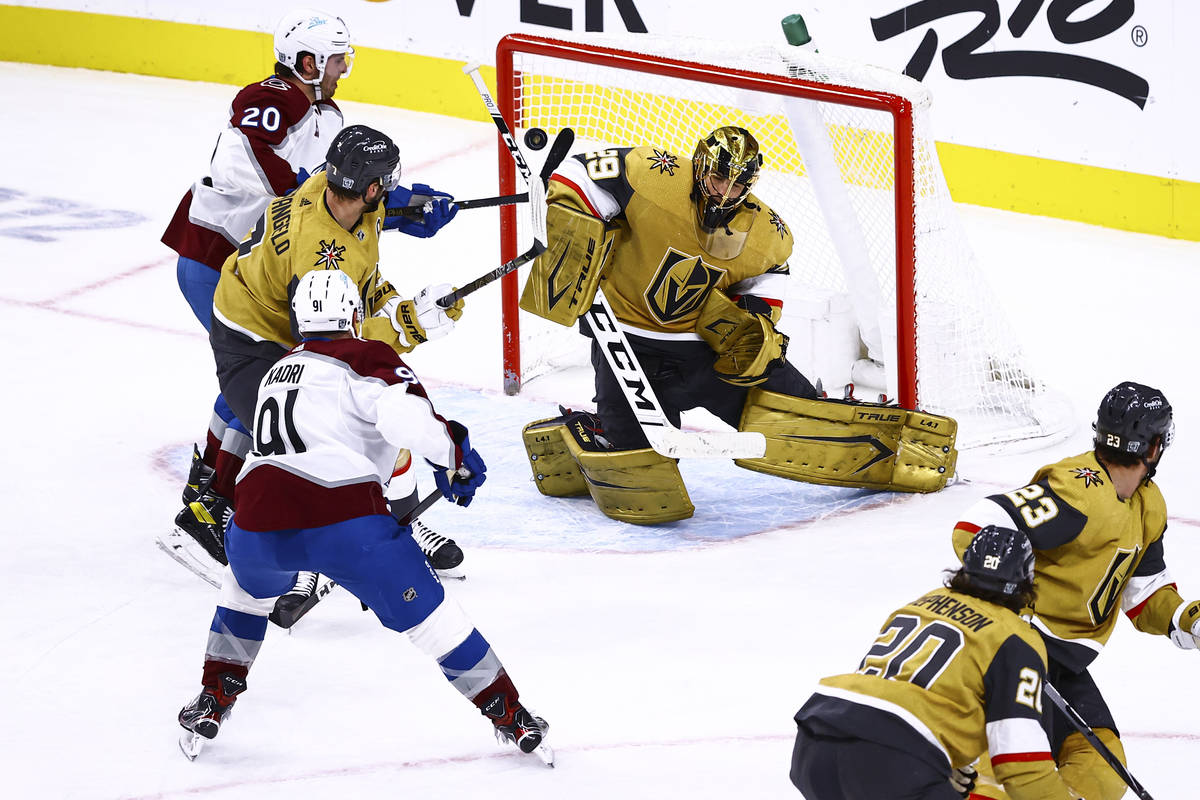 Golden Knights goaltender Marc-Andre Fleury (29) blocks the puck against Colorado Avalanche dur ...