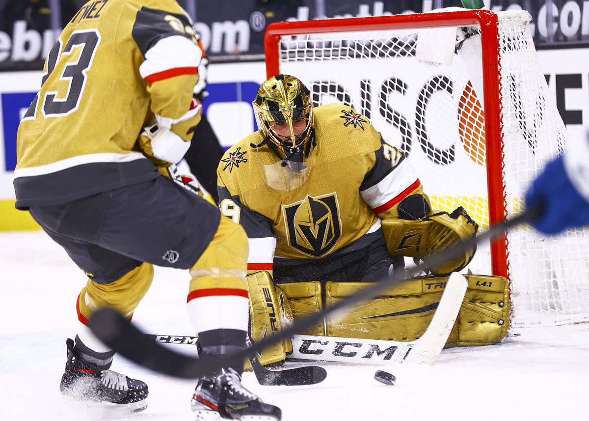 Golden Knights goaltender Marc-Andre Fleury (29) blocks the puck during the first period of an ...