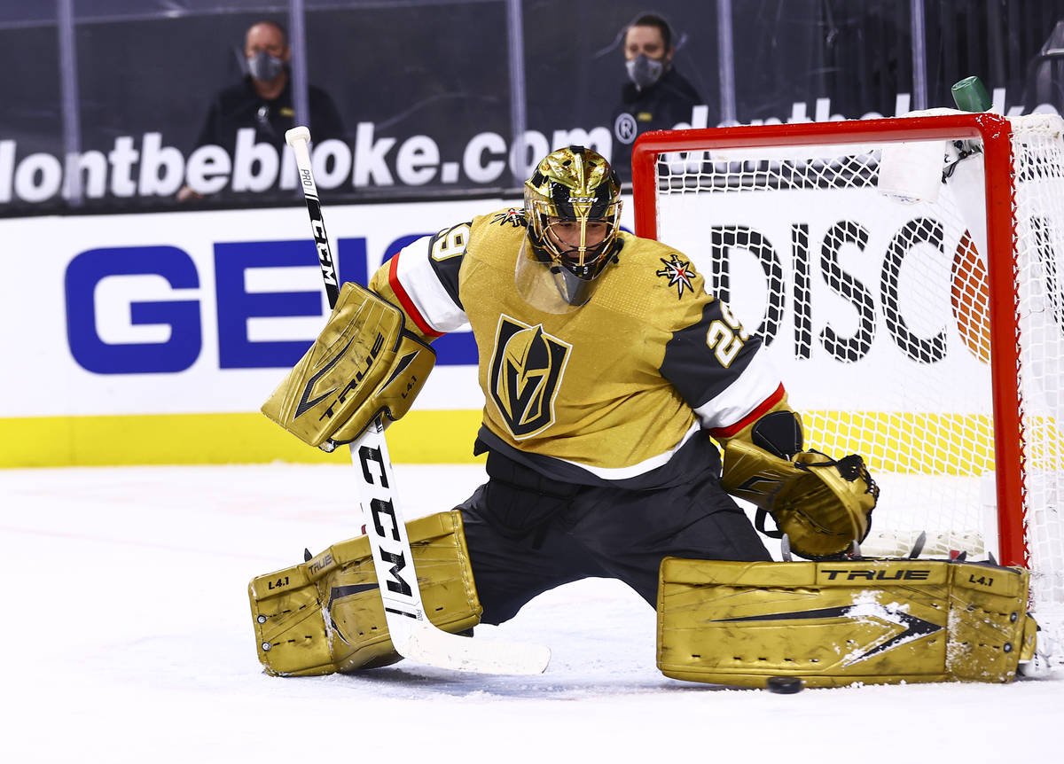 Golden Knights goaltender Marc-Andre Fleury (29) blocks the puck during the first period of an ...