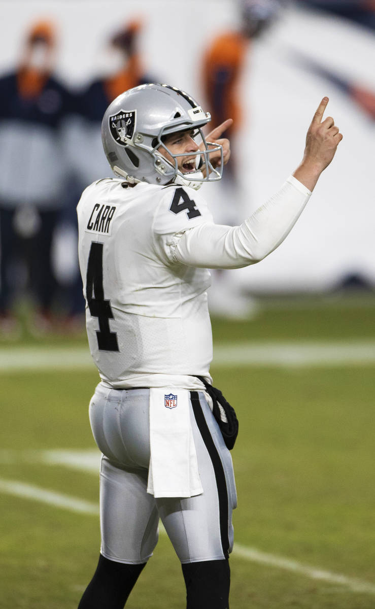 Raiders quarterback Derek Carr (4) celebrates a big play in the fourth quarter during an NFL fo ...