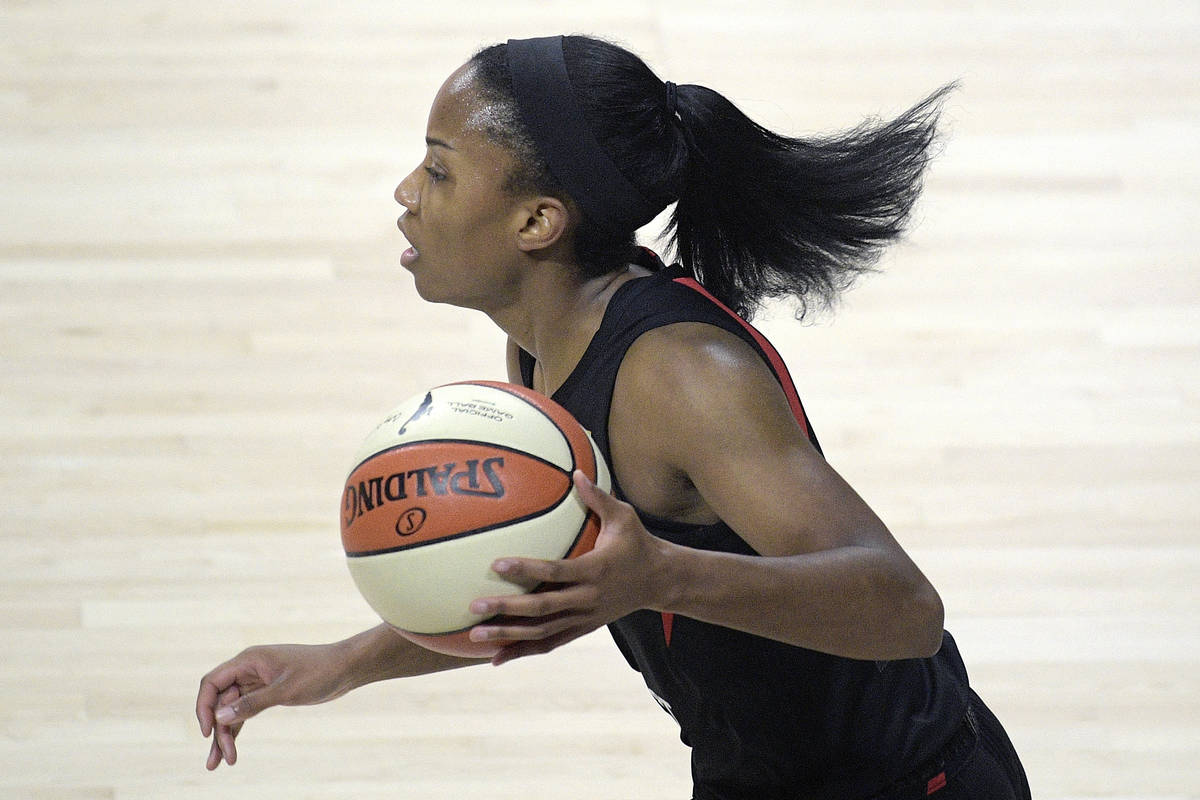 Las Vegas Aces guard Lindsay Allen pushes the ball up the court during the first half of a WNBA ...