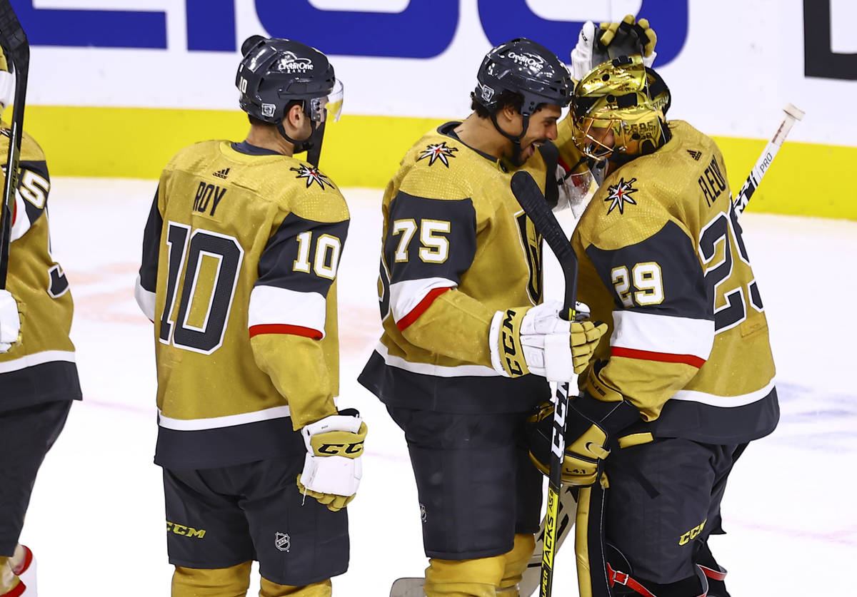 Golden Knights right wing Ryan Reaves (75) celebrates a 1-0 shutout win with goaltender Marc-An ...