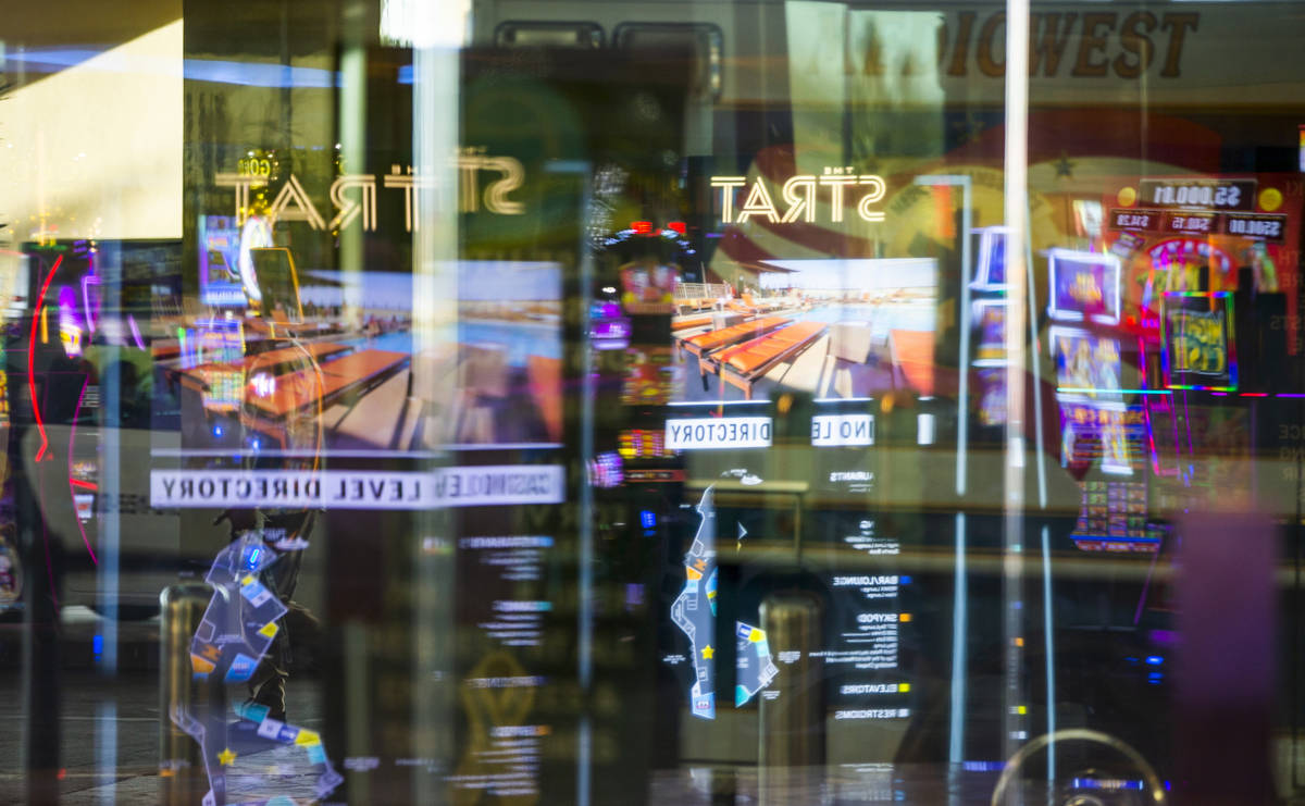 A variety of reflections about the main door at The Strat as casino floors have moved up to 35% ...