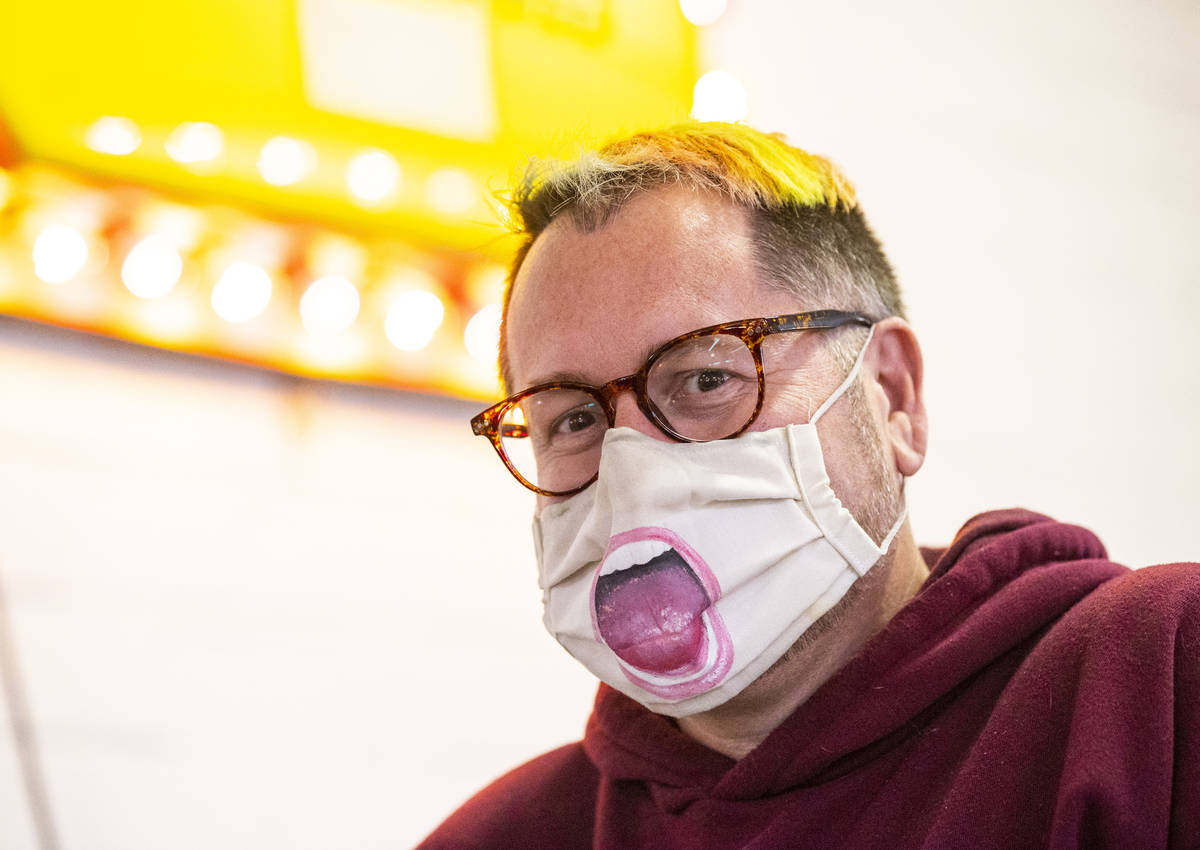 Chris Cope, of Las Vegas, poses for a portrait with his custom cloth mask at the Antique Alley ...