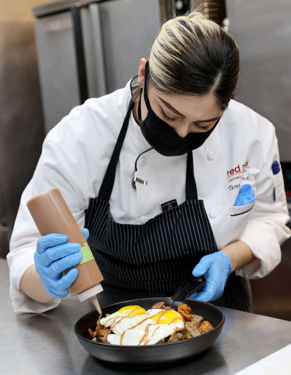 Chef Teresa Ramirez puts some finishing touches on a order of Prime Rib Hash, a menu item at th ...