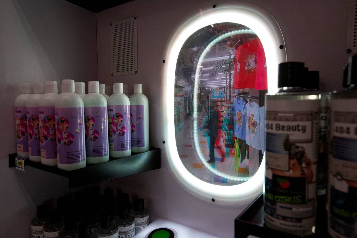 A beauty mirror allows customers to view themselves in a different way inside the Omega Mart at ...