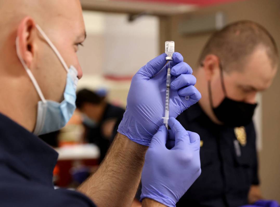 Las Vegas Fire Department paramedic Zach Allen, left, and Tyler Terrell, a paramedic with Medic ...