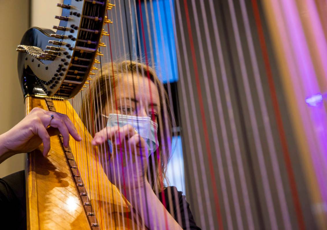 Harpist Melaney Jones plays for an Ash Wednesday service at Faith Community Lutheran Church on ...