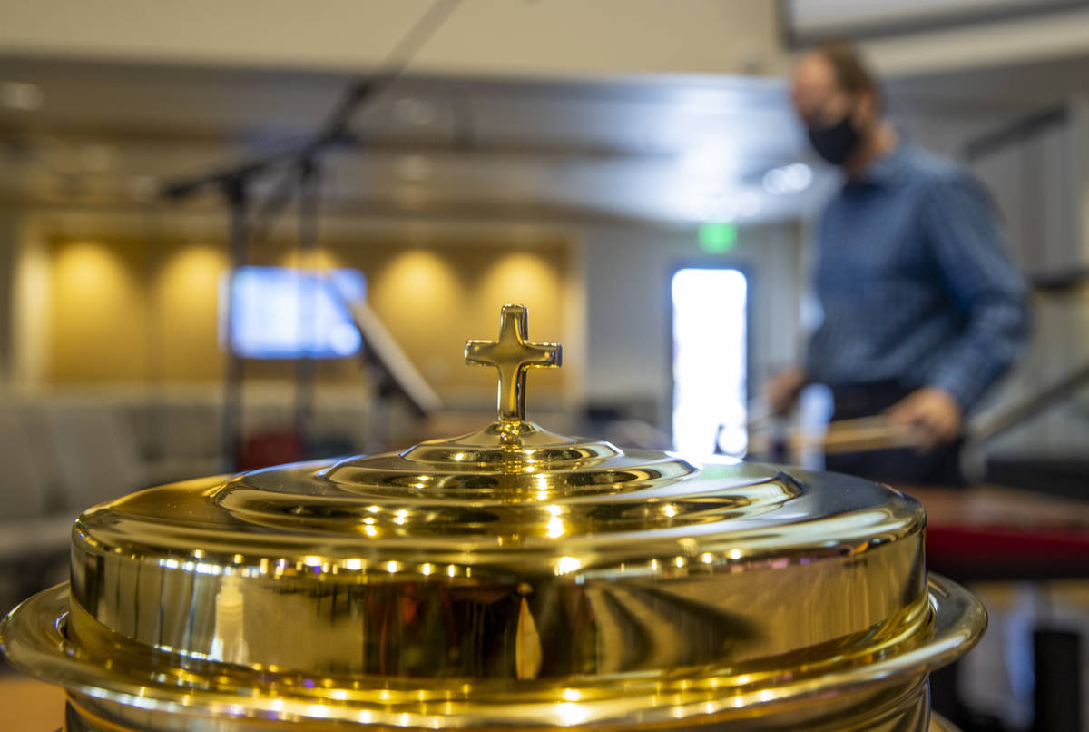 A communion vessel is in place as Tim Jones plays the marimba for an Ash Wednesday service at F ...