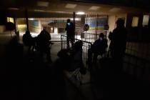 People wait in line to get their COVID-19 vaccine shots Saturday, Feb. 20, 2021, at Cashman Cen ...