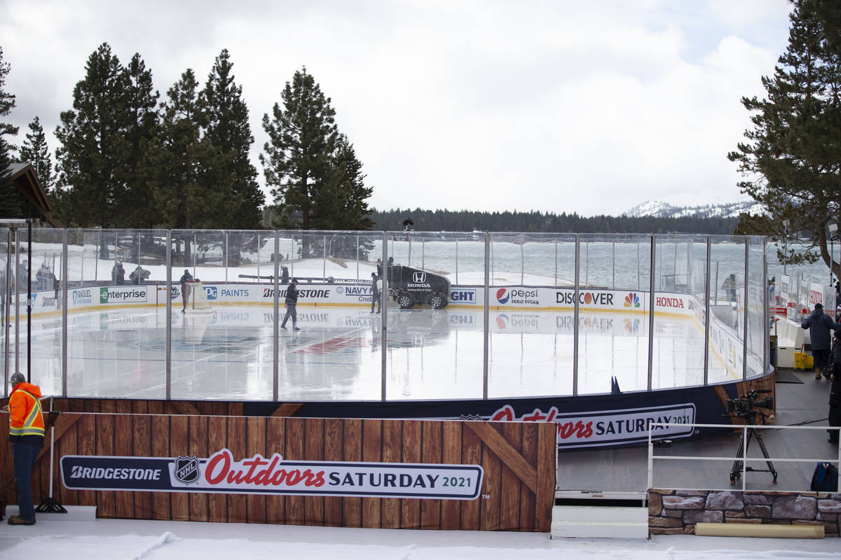 A zamboni cleans the ice prior to a practice on an outdoor rink in preparation for a Saturday N ...