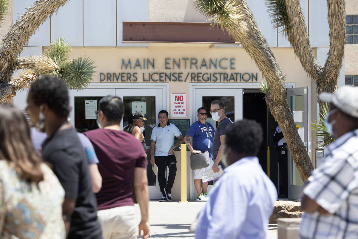 People wait in line at the Nevada Department of Motor Vehicles at 8250 W. Flamingo Road, on Mon ...