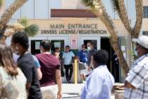 People wait in line at the Nevada Department of Motor Vehicles at 8250 W. Flamingo Road, on Mon ...