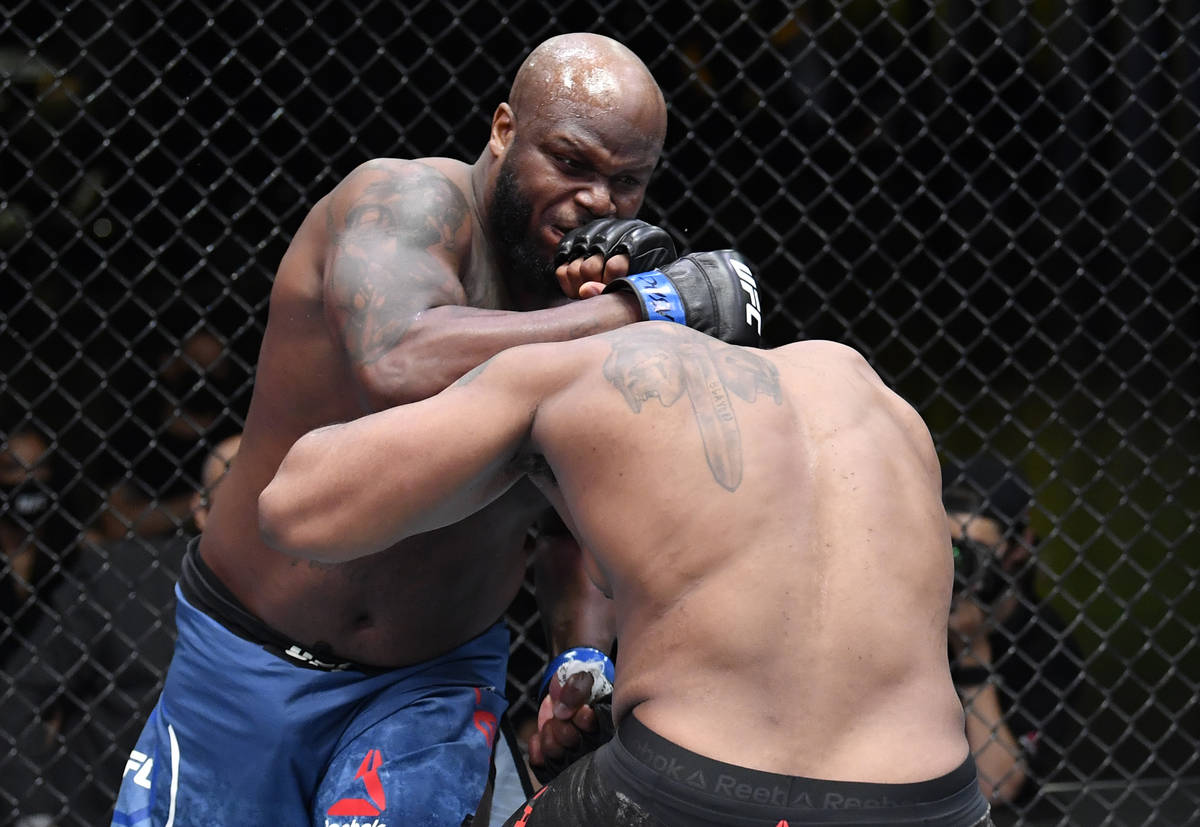 (L-R) Derrick Lewis punches Curtis Blaydes in a heavyweight bout during the UFC Fight Night eve ...