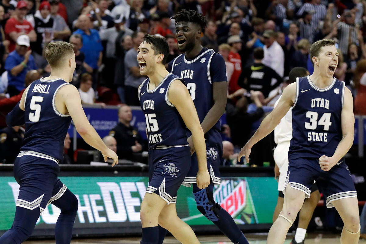Utah State reacts after Sam Merrill (5) sunk a 3-point basket with seconds remaining in the sec ...