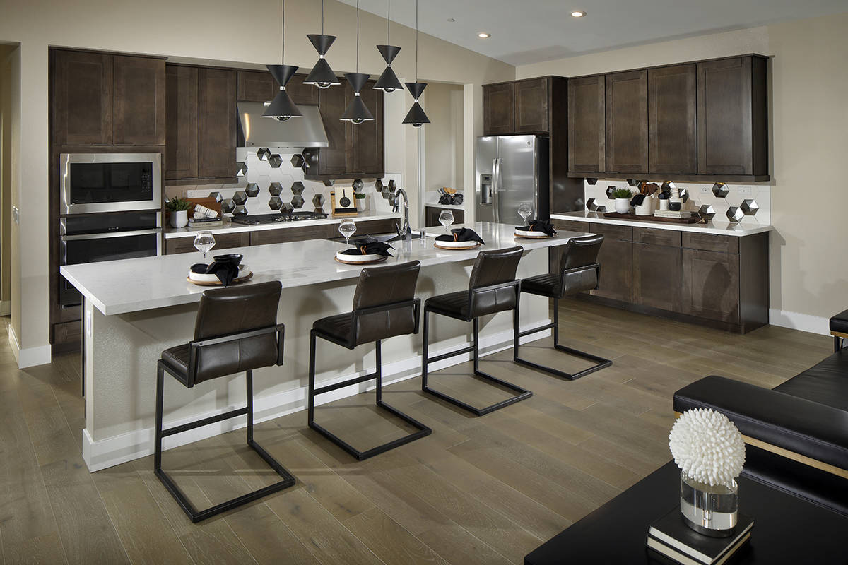 Strada in Inspirada, a Henderson master-planned community, features a kitchen with an island. T ...