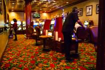 A worker sanitizes a gaming area at the El Cortez on Thursday, June 4, 2020. (Chase Stevens/Las ...