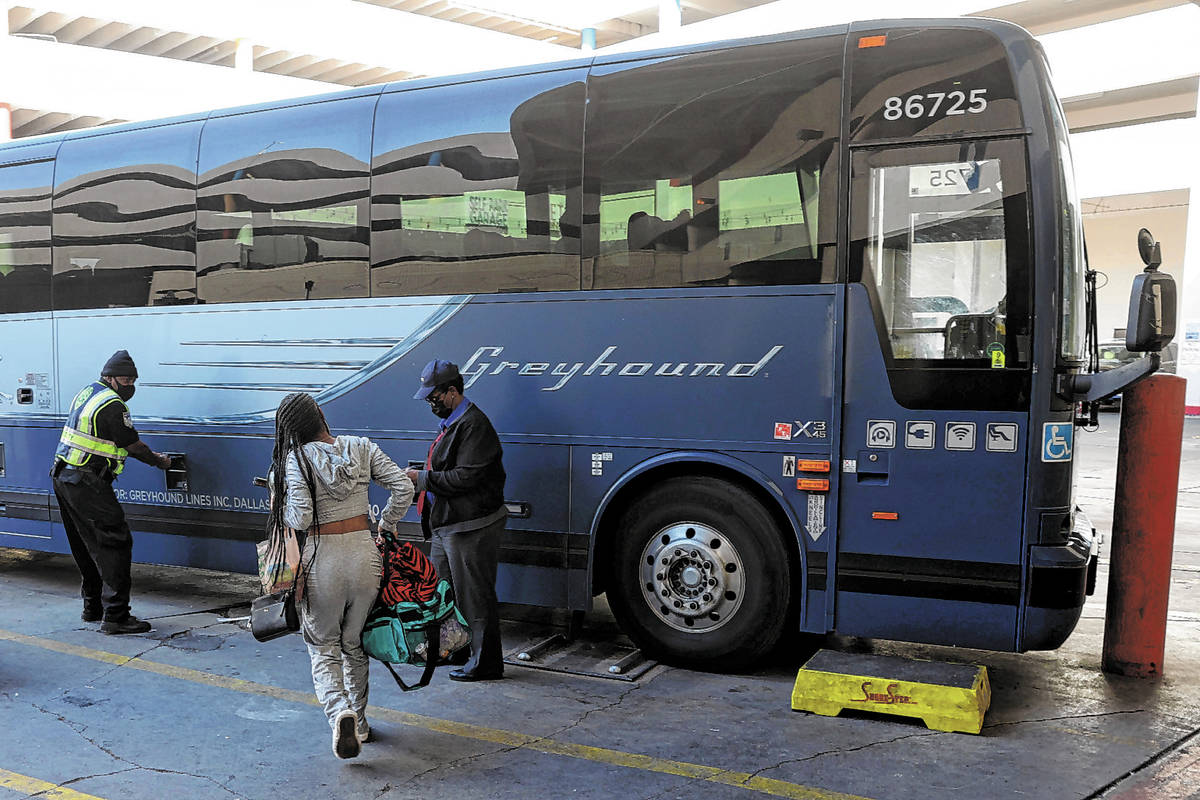 The final customer runs to catch the final bus leaving the Greyhound bus terminal on Main Stree ...