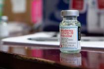 The North Las Vegas Fire Department administrates it's first batch of a COVID-19 vaccines to fi ...