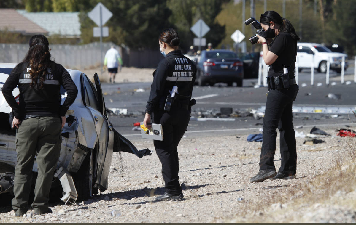 Las Vegas police investigate a crash at the intersection of Warm Springs Road and South Schirll ...
