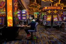 Zaw Naw of Denver plays the Hot Stuff Wicked Wheel slots on the casino floor at the Strat on We ...