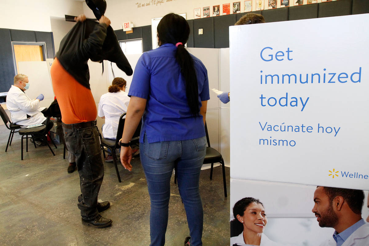 The Immigrant Home Foundation and Walmart conduct a first-dose vaccine clinic in east Las Vegas ...