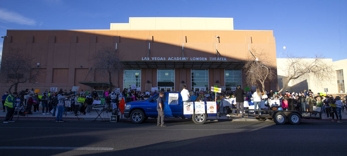 A group of at least 100 people protests outside Las Vegas Academy of the Arts before Clark Coun ...