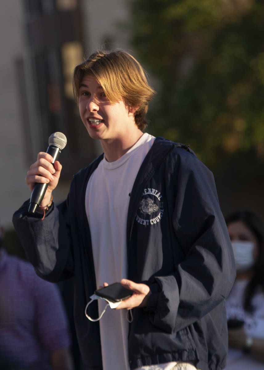 Caden McKnight, student body president at Centennial High School, speaks to a group of proteste ...