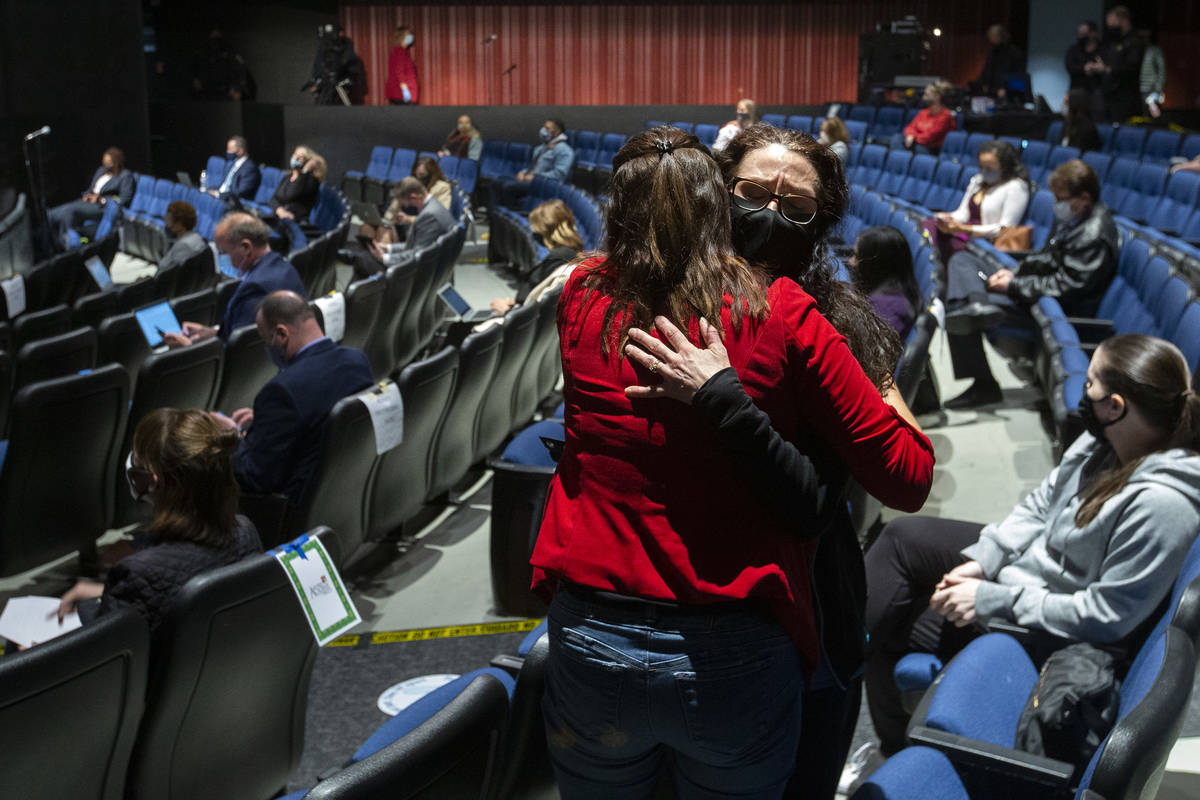 Nicole Goughnour hugs a friend after speaking during the comment period of Clark County School ...