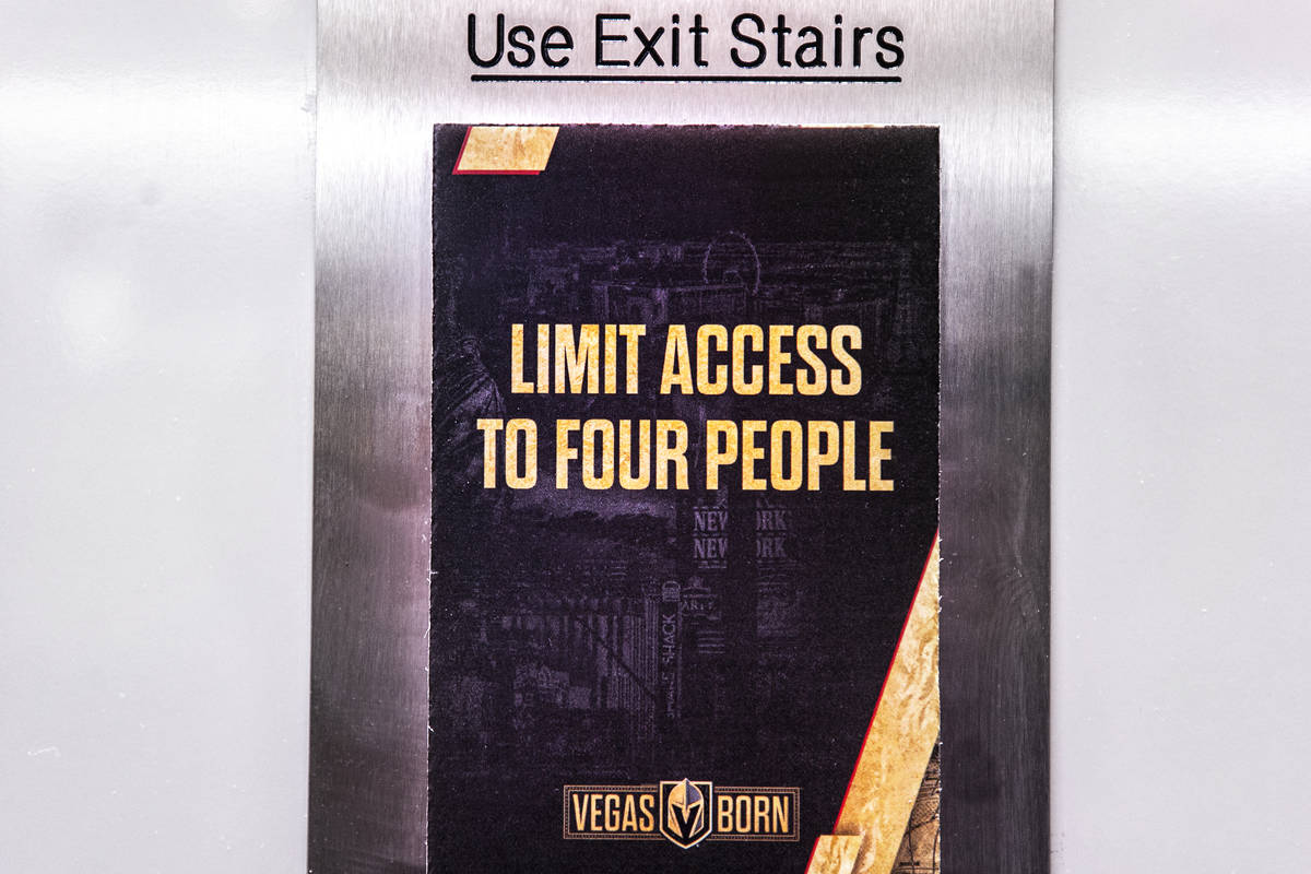 Signs restricting elevator capacity due to COVID-19 at T-Mobile Arena on Thursday, Feb. 25, 202 ...