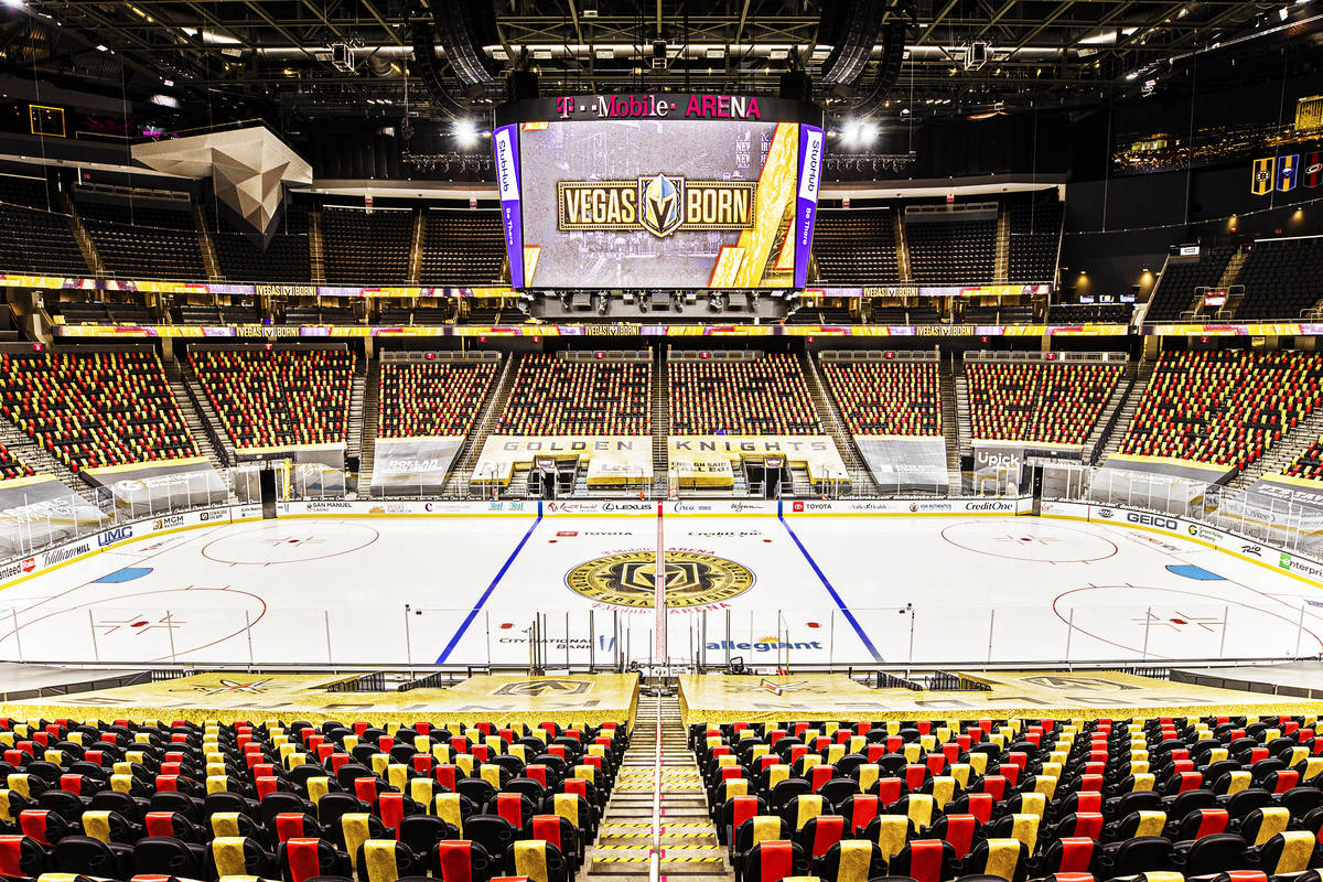 Red and gold wrapped seats provide social distance between fans at T-Mobile Arena on Thursday, ...
