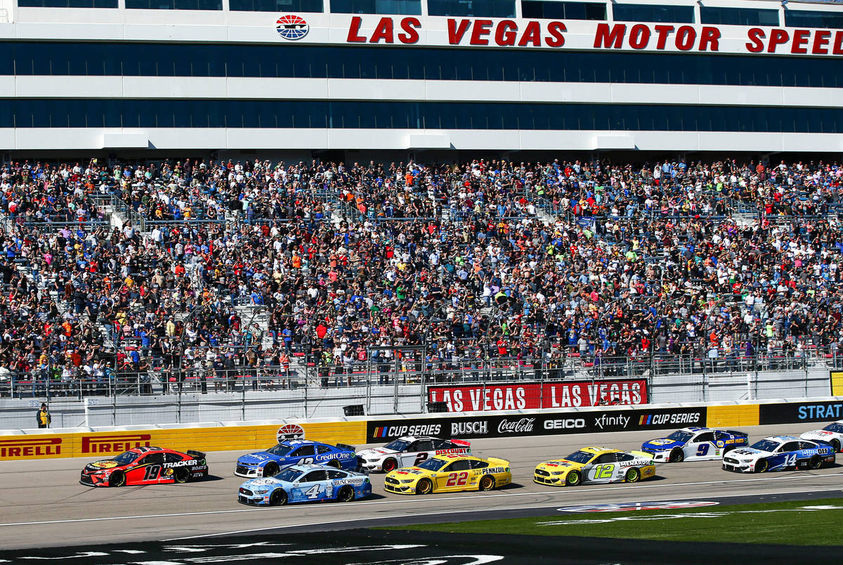 Cars round the track during a NASCAR Cup Series auto race at Las Vegas Motor Speedway on Sunday ...
