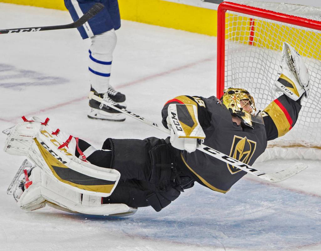 Vegas Golden Knights goaltender Marc-Andre Fleury (29) makes a diving save in the third period ...