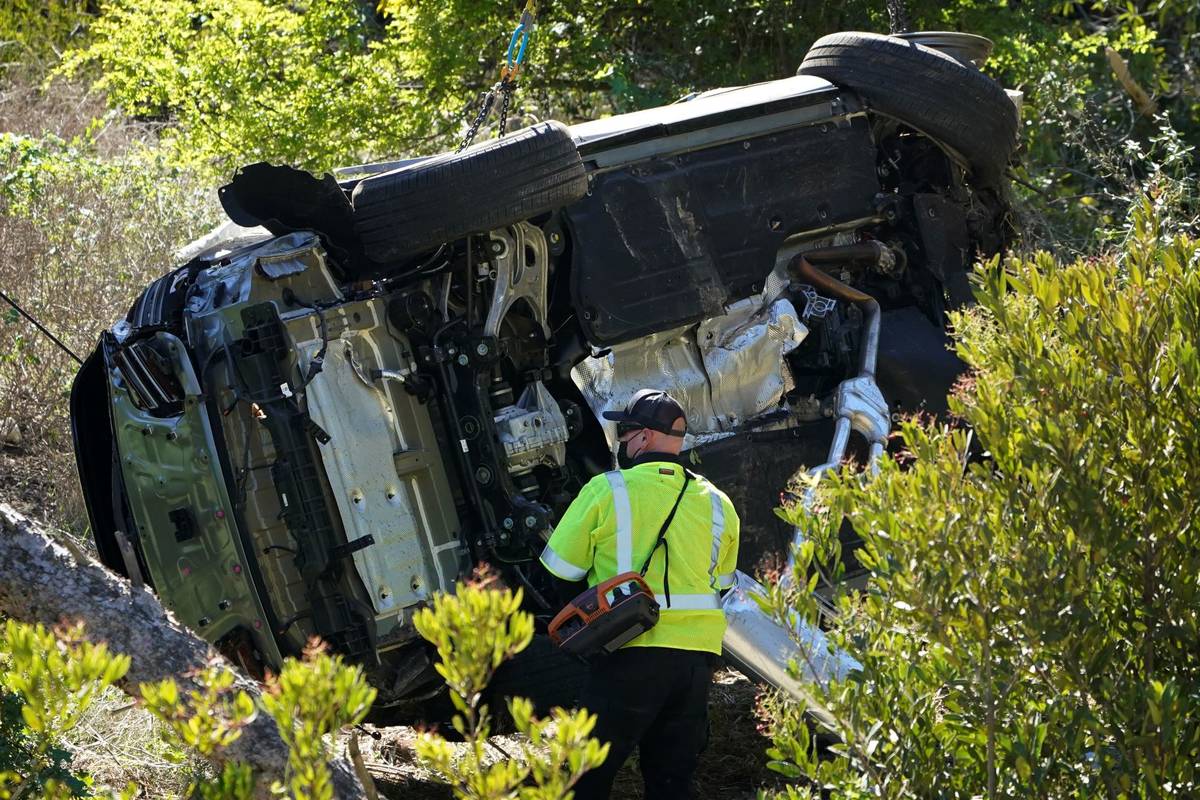 A vehicle rests on its side after a rollover accident involving golfer Tiger Woods Tuesday, Feb ...