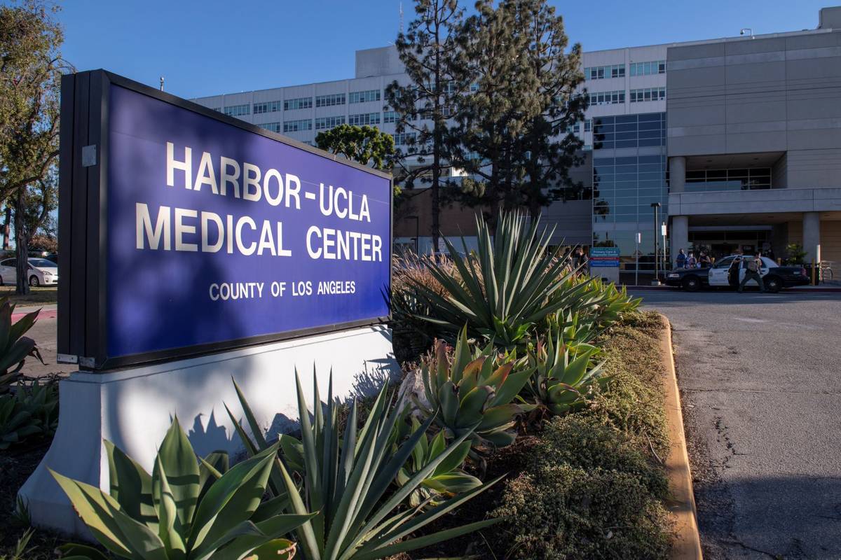 A sheriff's car is parked outside of Harbor-UCLA Medical Center, Tuesday, Feb. 23, 2021, in Tor ...