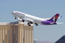 A Hawaiian Airlines jetliner departs from McCarran International Airport in Las Vegas in 2017. ...