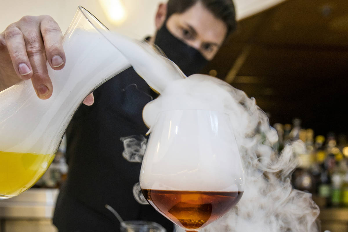 Bartender Casey Freeman creates a Foggy Hill Negroni made with Vida mezcal, Cynar, Aperol, fog ...