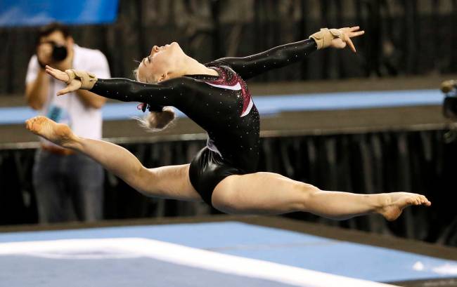 Stanford's Taylor Rice competes in the floor exercise during the NCAA women's gymnastics champi ...