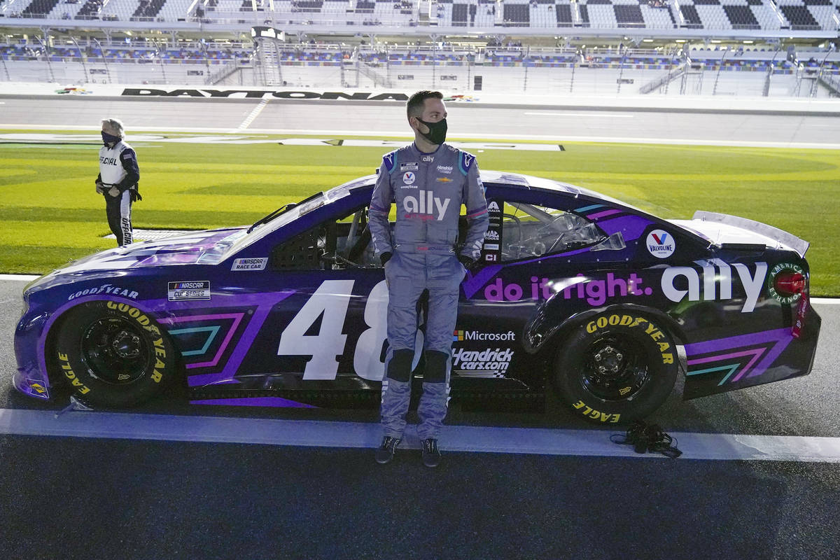 Alex Bowman stands by his car before the start of the NASCAR Clash auto race at Daytona Interna ...