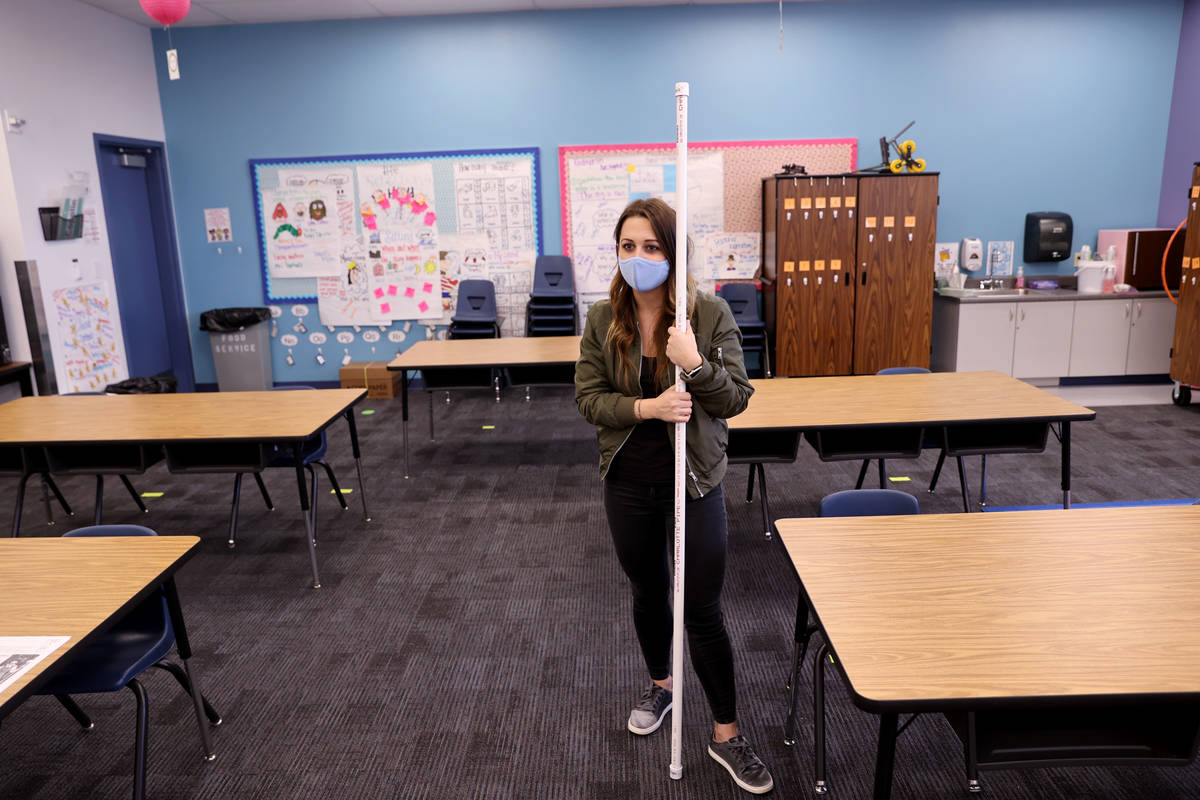 Dearing Elementary School first grade teacher Kali Copplin uses a six-foot length of PVC pipe t ...