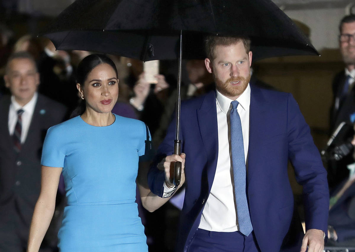 FILE - In this March 5, 2020, file photo, Britain's Prince Harry and Meghan, Duchess of Sussex, ...