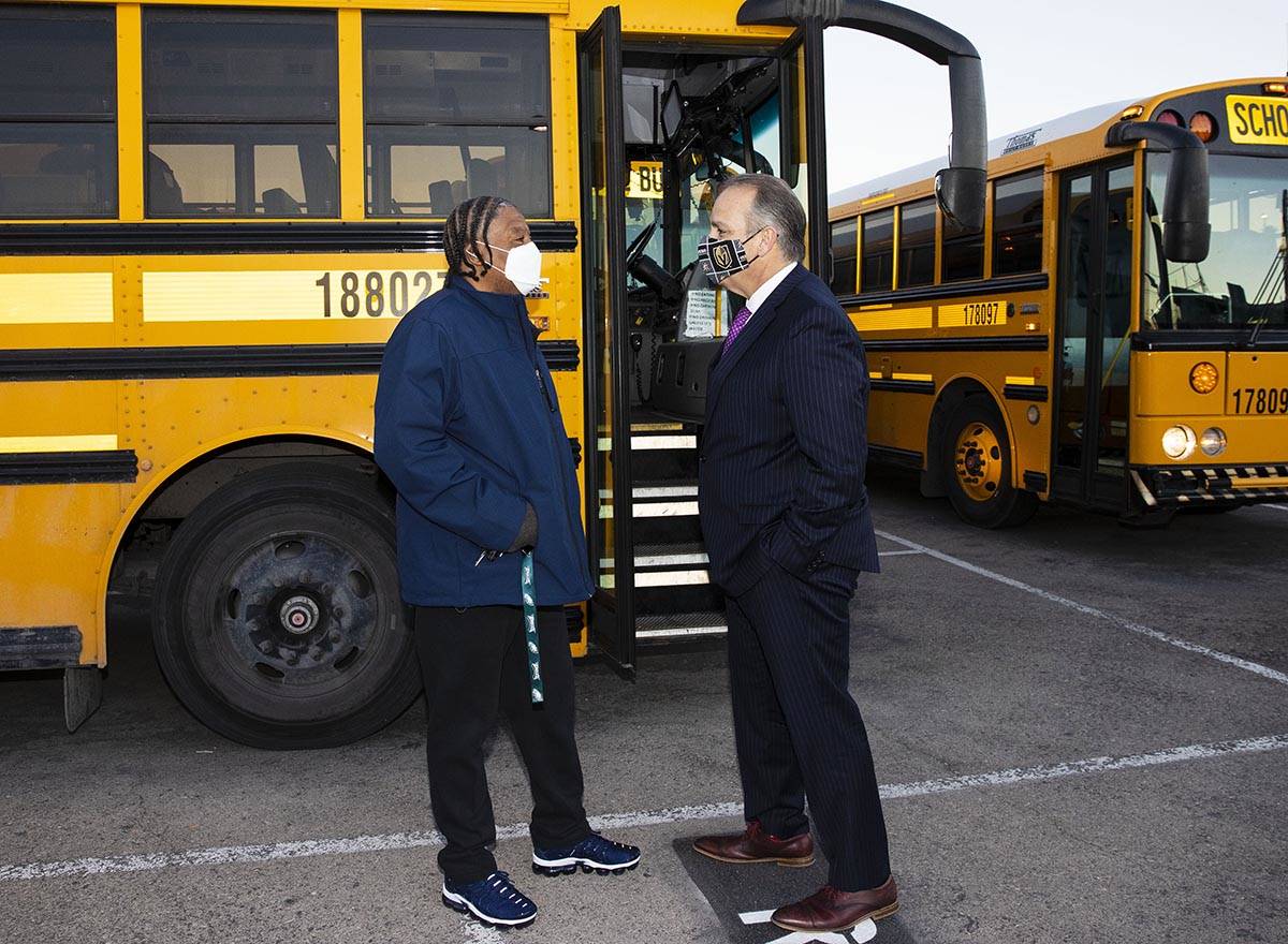 Clark County School District Superintendent Jesus Jara, right, chats with Jerry Preston, a scho ...