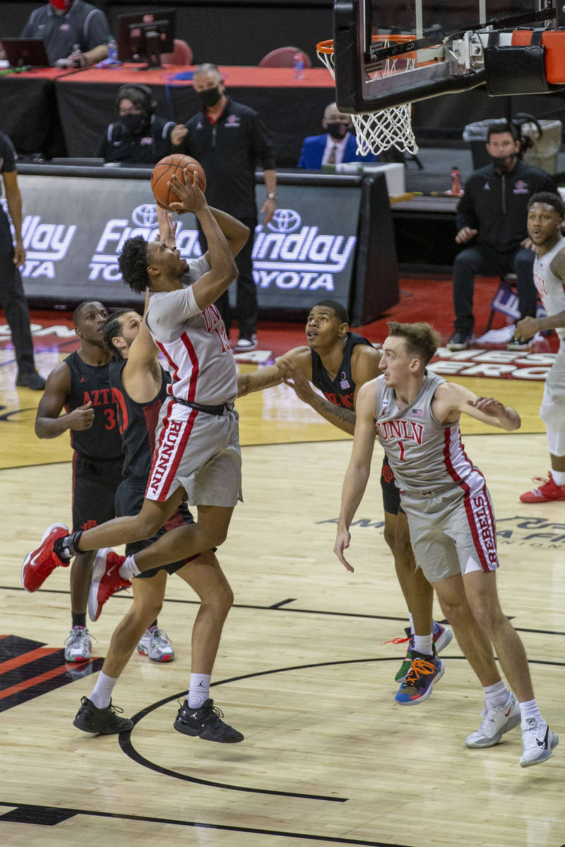 UNLV Rebels guard Bryce Hamilton (13) goes up for a jump shot during the first half of an NCAA ...