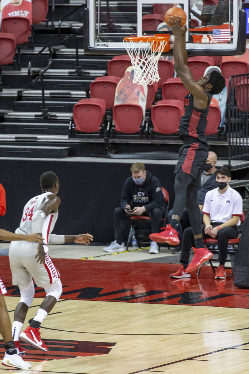 San Diego State Aztecs forward Nathan Mensah (31) dunks as UNLV Rebels forward Cheikh Mbacke Di ...