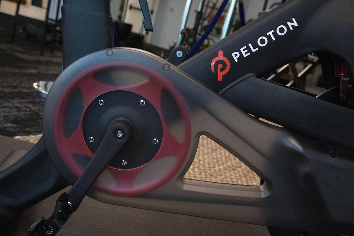 FILE-This Sept. 26, 2019, file photo shows the Peloton logo on the company's stationary bicycle ...