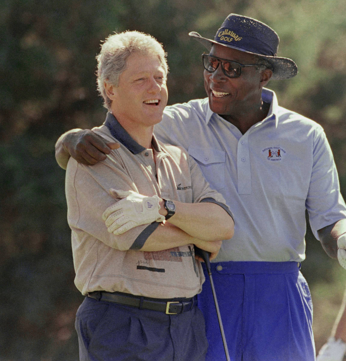 FILE- In this Aug. 22, 1993 file photo, President Bill Clinton receives some consoling advice f ...