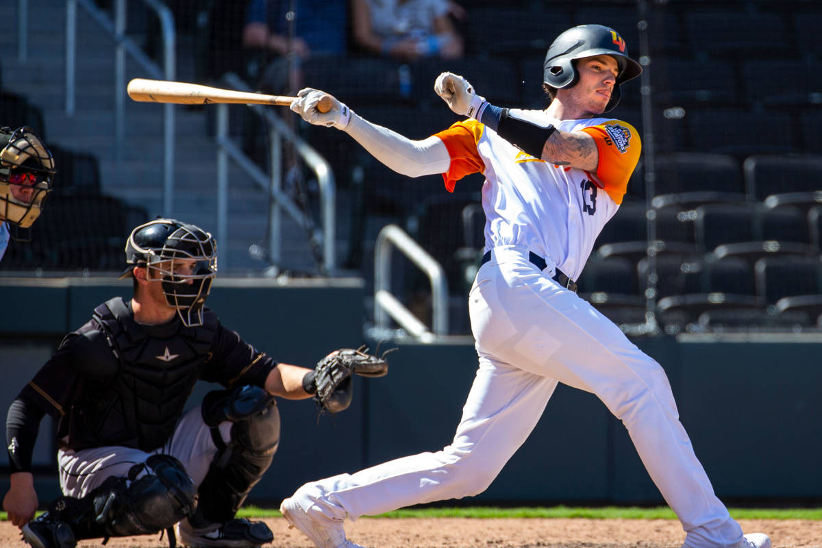 Las Vegas Aviators catcher Jonah Heim (13) misses the ball while batting in the ninth inning ve ...