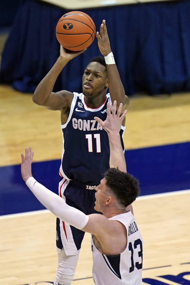 Gonzaga guard Joel Ayayi (11) shoots as BYU guard Alex Barcello (13) defends in the second half ...
