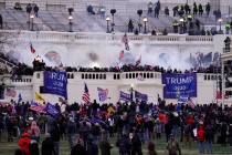 In a Wednesday, Jan. 6, 2021, file photo, rioters storm the Capitol, in Washington. At least 10 ...